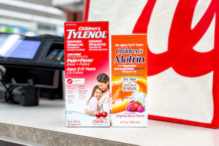 walgreens tylenol and motrin sitting on store counter sponsored