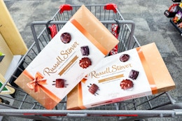 2 boxes of russell stover chocolates in a cart