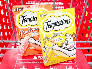 Two packages of Temptations Purre Cat Treats in Target shopping cart