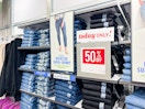 old navy jeans in stores next to a sign that says "today only! 50% off"