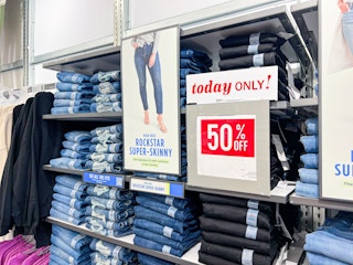 old navy jeans in stores next to a sign that says "today only! 50% off"