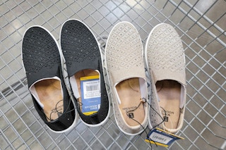 2 pairs of ladies bling sneakers in a cart