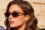 a woman wearing retro sunglasses