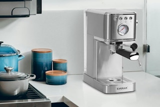 espresso machine on kitchen counter next to stove