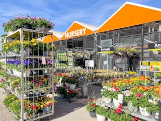 Flowers and flower baskets on display outside The Home Depot Nursery