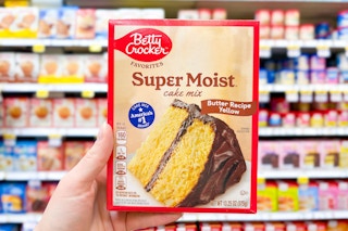 hand holding up a box of betty crocker cake mix