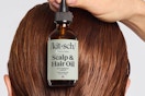 a woman holding kitsch hair oil