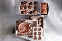 Lifestyle image of the Carote 9 Pc Stackable Nonstick Bakeware Set in the color brown