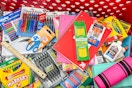 A target shopping cart filled with school supplies 