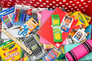 A target shopping cart filled with school supplies 