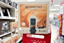 magnolia nespresso vertuoplus coffee maker sitting on a target cart