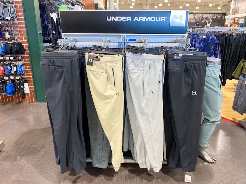 A variety of Under Armour sweatpants hanging in Dicks Sporting Goods