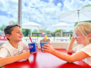 two kids eating dairy queen blizzards