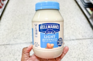 hand holding a jar of Hellman's light mayonnaise