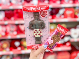 hand holding the perfect man chocolate bar and perfect man mini chocolate bar