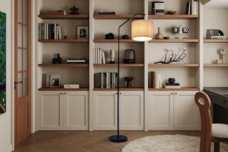 adjustable floor lamp in front of shelves
