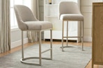 Lifestyle image of two Leick Bar Stools in a oatmeal finish