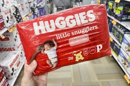 hand holding huggies preemie diapers at meijer
