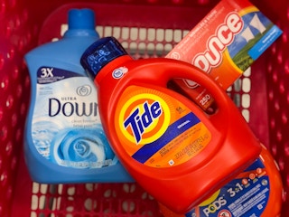 bottles of Tide and Downy in store shopping cart