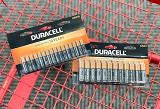 Two packs of Duracell batteries in a Office Depot shopping cart.