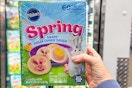 hand holding up a package of pillsbury spring cookie dough