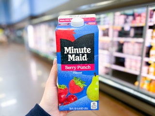 hand holding a minute maid drink carton