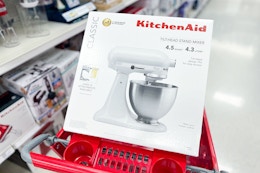 kitchenaid stand mixer sitting on top a target cart
