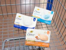 3 dove bar soap packs sitting in a walmart cart
