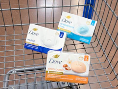 3 dove bar soap packs sitting in a walmart cart
