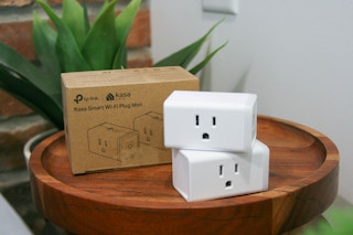 two smart plugs on a table