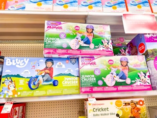 3 fly wheels junior cruisers sitting on a target shelf