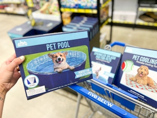 someone holding up the pet pool box in store at five below