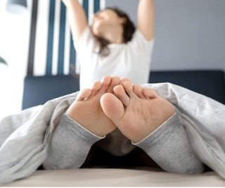 Dr. Frederick's Heel Grey Socks on a model's feet
