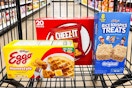 boxes of eggo waffles, cheez-it crackers, and rice krispies treats in a cart