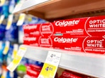 colgate optic white stain fighter toothpaste on shelf in walgreens
