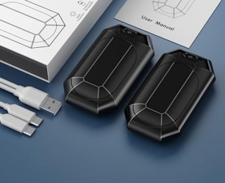 two hand warmers on a table