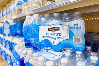 clover valley bottled water stacked on shelf