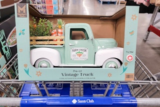 spring vintage truck decor piece in a cart