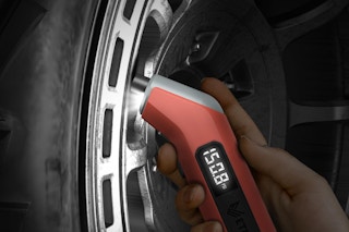 a digital tire pressure gauge on a tire