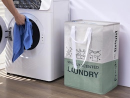 a laundry basket next to a washer