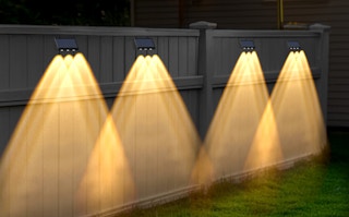 solar lights on a fence outside