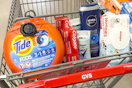 tide pods, colgate toothpaste, degree deodorant, nivea men body wash, and huggies baby wipes in a cart