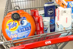 tide pods, colgate toothpaste, degree deodorant, nivea men body wash, and huggies baby wipes in a cart