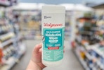 hand holding walgreens disinfecting wipes