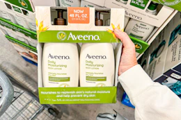 hand holding aveeno lotion