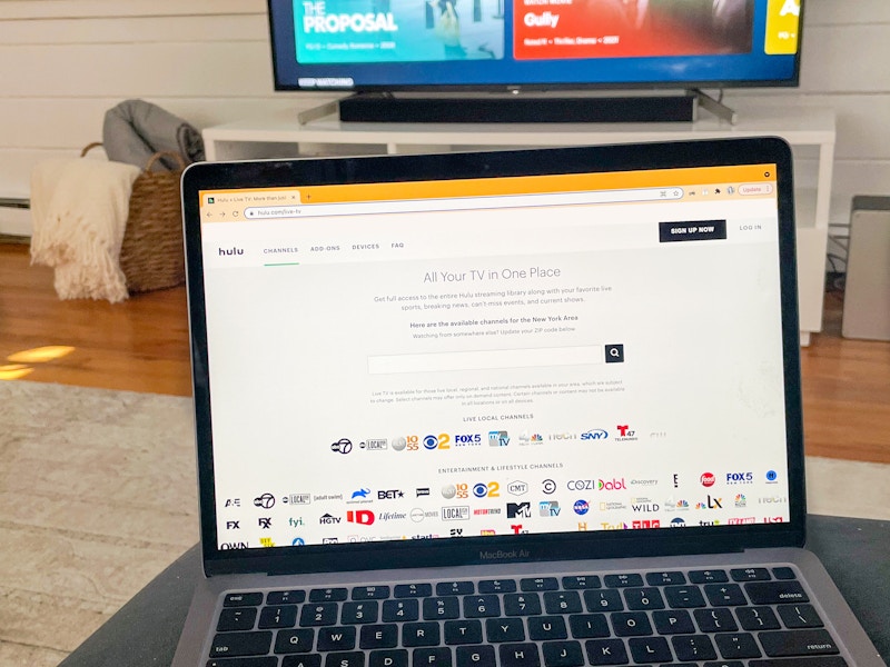 hulu tv live homepage shown on laptop in living room