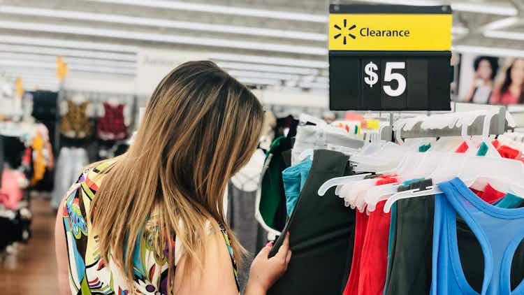 A woman shops the clearance section of Walmart