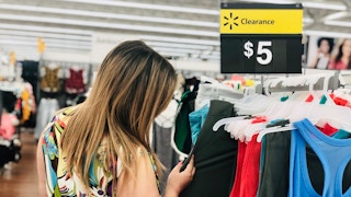 A woman shops the clearance section of Walmart