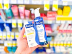 hand holding panoxyl products in walgreens