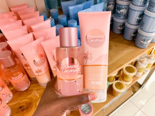 hand holding body care items